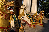 Vientiane, Laos - Pha That Luang, Other structures on the ground include a bell tower, several stupas, a number of pavilions sheltering images of the Buddha.  